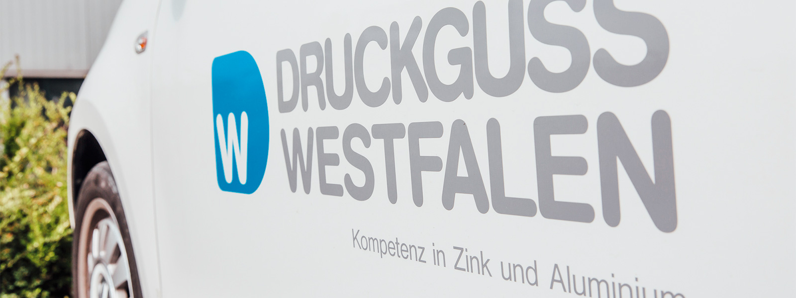 Delivery vehicle with Druckguss Westfalen logo and slogan, “Kompetenz in Zink und Aluminium” (“Expertise in zinc and aluminium”)